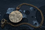 Collier bronze verso aux motifs fleurs en relief bijou littéraire poème " MAUVAIS SANG" Collection : une saison en enfer